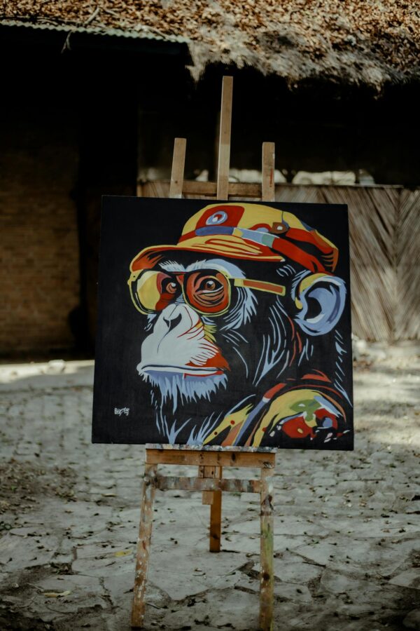 A painting of a monkey wearing sunglasses and a hat
